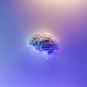 how to clear brain fog, a glowing brain on a soft purple gradient