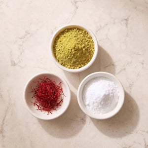 Three bowls holding green L-theanine powder, red saffron threads and white magnesium glycinate powder side by side, the saffron, L-theanine and magnesium mood stack at 30mg Affron, 200mg L-theanine and 100mg magnesium glycinate per serving