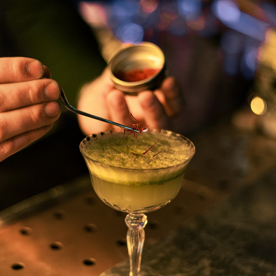 saffron vs rhodiola for stress and mood, saffron threads garnishing a drink