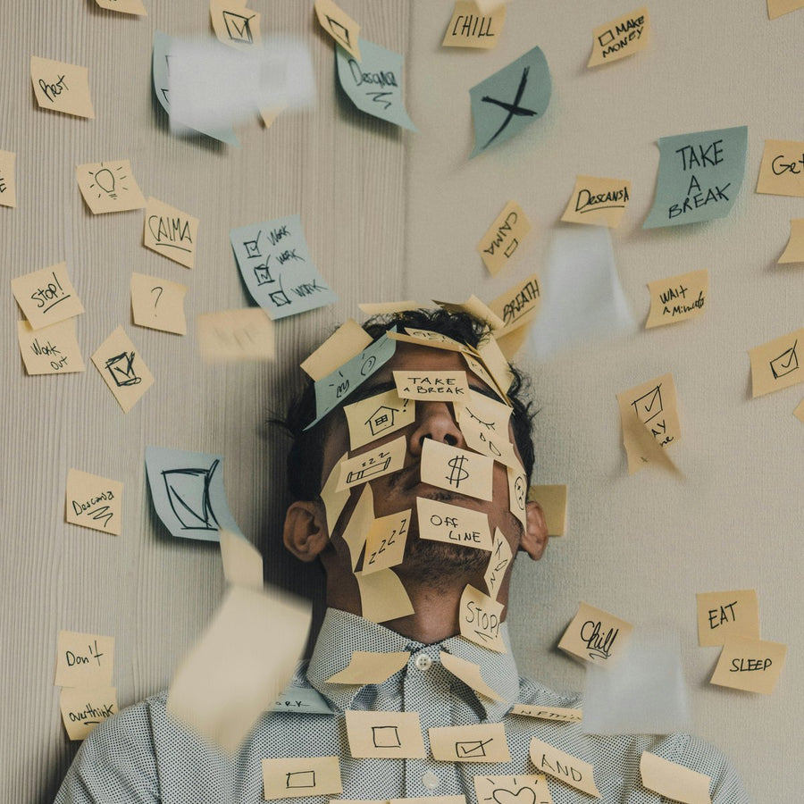 why am I so irritable, a person overwhelmed under scattered sticky notes