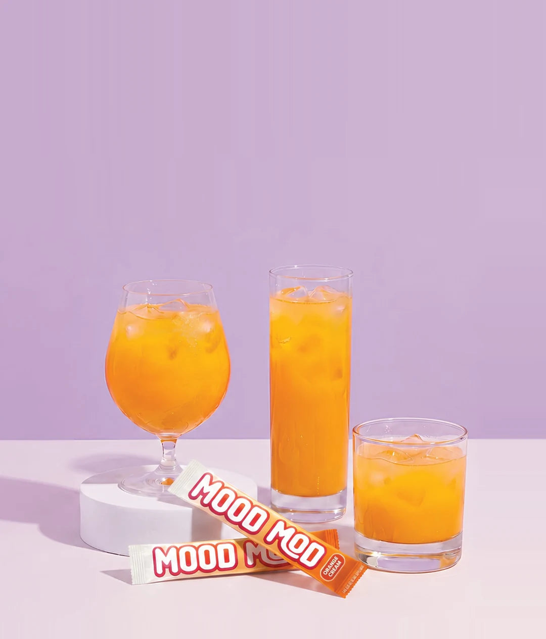 Mood Mod saffron orange cream drink, iced drinks and stick packs.