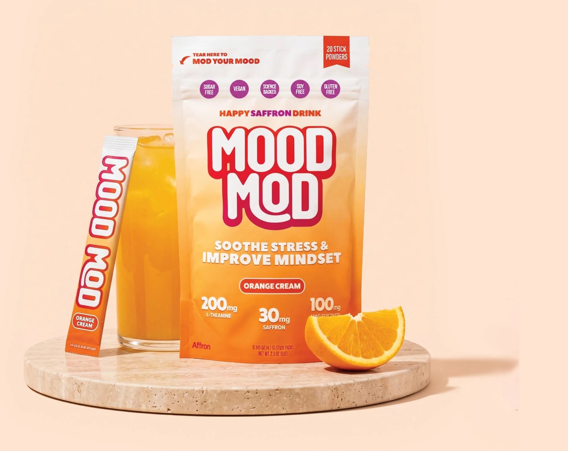 Mood Mod orange cream drink mix pouch, glass, and stick pack